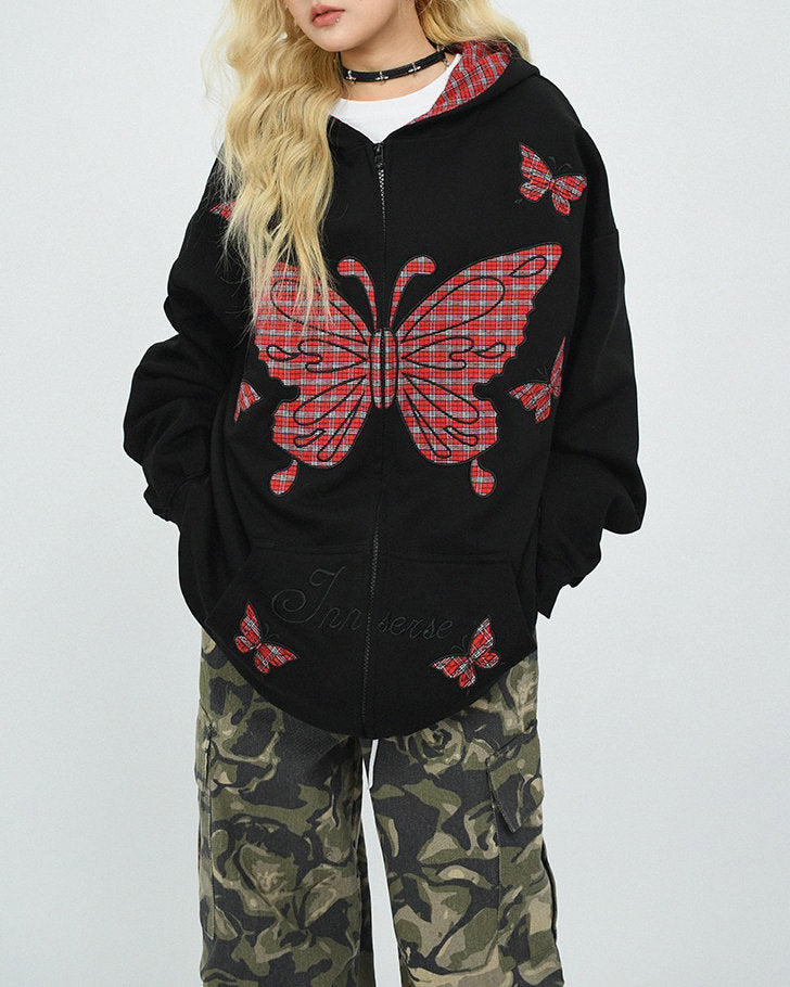 This 90's grunge hoodie features an oversized fit, plaid butterfly patches on the chest and sleeves, and a zip-up closure on the front. The hood is lined with red plaid fabric - boogzel clothing