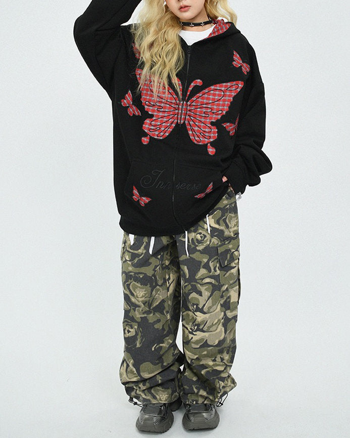 This 90's grunge hoodie features an oversized fit, plaid butterfly patches on the chest and sleeves, and a zip-up closure on the front. The hood is lined with red plaid fabric - boogzel clothing