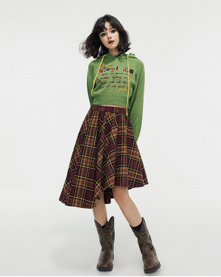 This preppy cropped hoodie in green features a cute 'Chemistry' print, ruffled collar details, and a knit construction