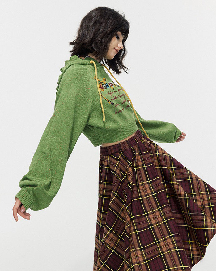 This preppy cropped hoodie in green features a cute 'Chemistry' print, ruffled collar details, and a knit construction
