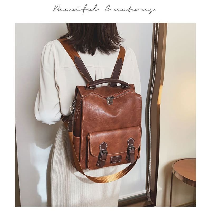 Faux Leather Buckled Backpack