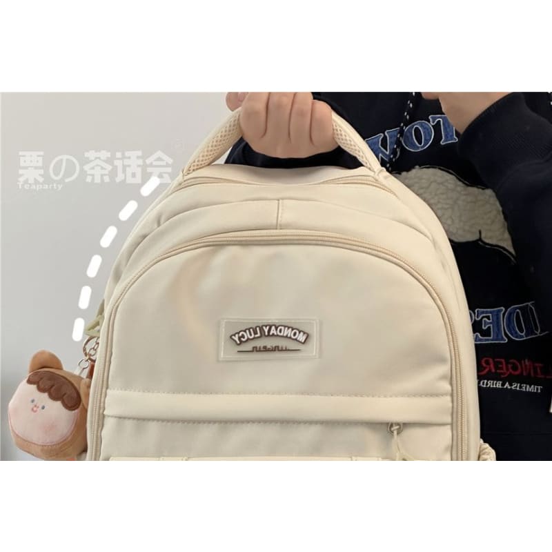 Lettering Label Buckled Flap Laptop Backpack