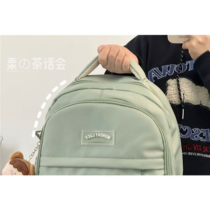 Lettering Label Buckled Flap Laptop Backpack