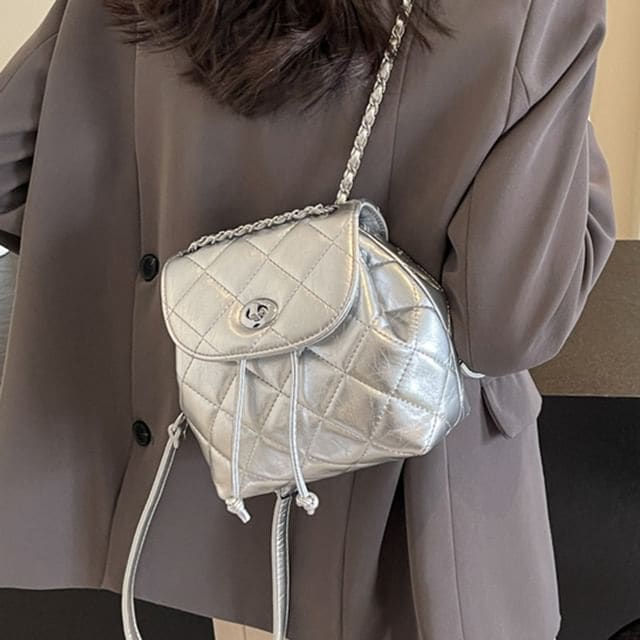 Quilted Drawstring Flap Backpack